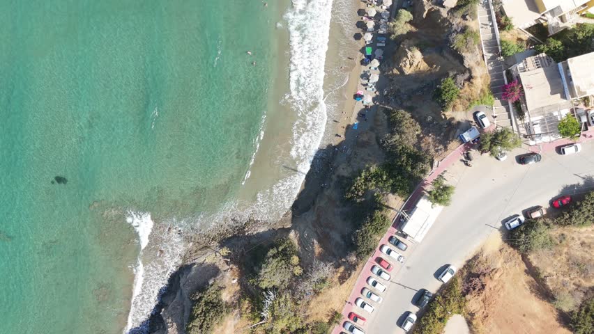 Aerial view of coastal landscape in Crete, Greece, featuring Mediterranean Sea, beach scenery