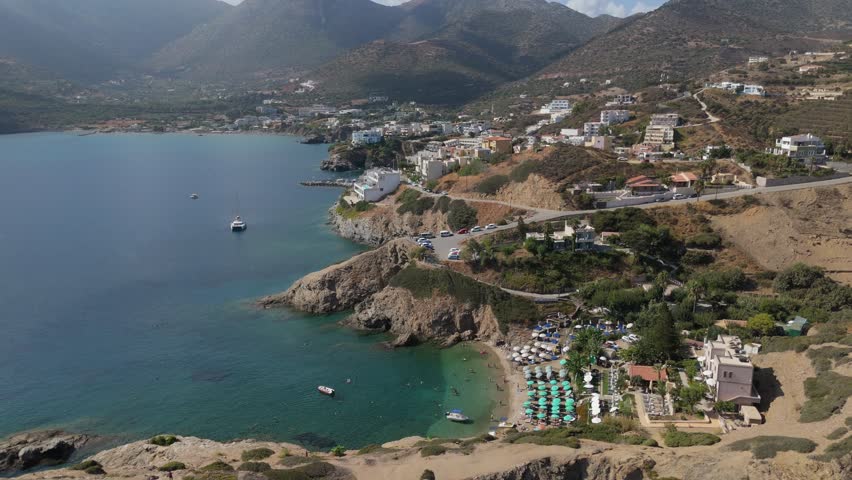 Aerial view of coastal landscape in Crete, Greece, featuring Mediterranean Sea, rocky shoreline and island scenery
