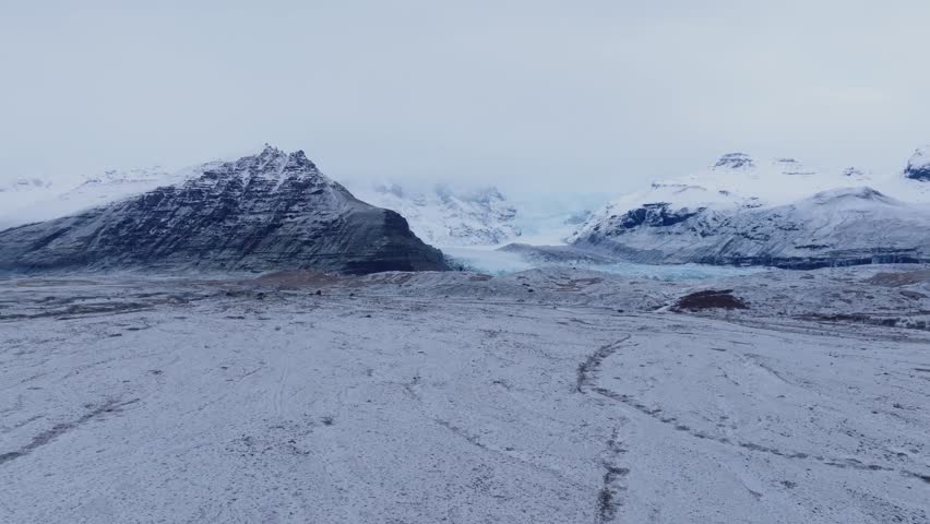 Vatnajokull glacier covered in mist, frozen Iceland majestic landscape - 4k aerial