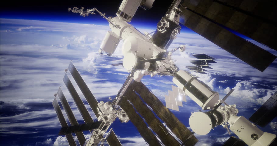 The International Space Station floats above Earth, revealing a stunning view of clouds and blue atmosphere. Solar panels stretch out, capturing sunlight in the serene expanse of space.