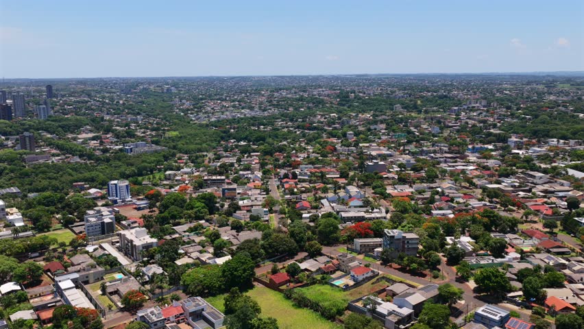 Drone over Avenida das Cataratas revealing Foz do Iguaçu cityscape