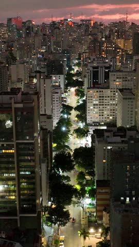 Sunset at Sao Paulo Brazil. Cityscape of sunset sky at city Sao Paulo Brazil. Scenic landscape of colorful sky and illuminated towers offices buildings and skyscrapers. Urban life scenery.