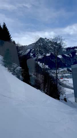 View of snow-capped mountains in Switzerland from the funicular. View of the mountains in Engelberg.