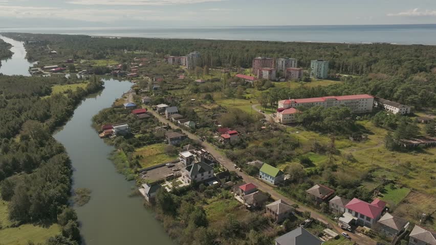 Aerial footage showing the coastal town of grigoleti, with its river and buildings near the sea