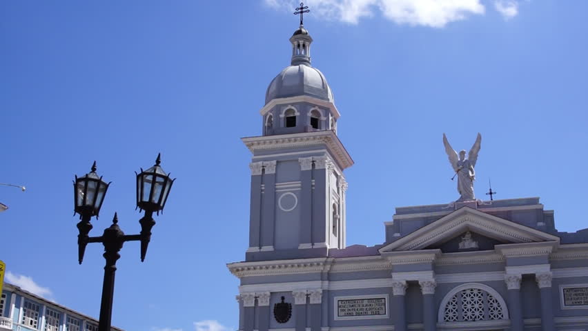 Colonial style facade of the roman catholic cathedral church building in the center of Santiago de Cuba