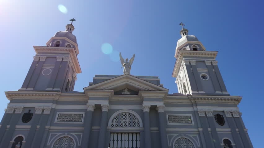 Colonial style facade of the roman catholic cathedral church building in the center of Santiago de Cuba