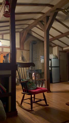 Warm Cinematic Interior of a cabin with a fire wood stove.
