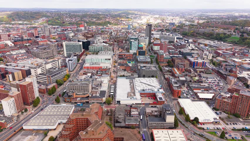 SHEFFIELD, SOUTH YORKSHIRE, UK - JANUARY 28, 2026. Aerial landscape drone footage above Sheffield city centre in South Yorkshire, UK with high street stores and cityscape skyline