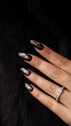 At the beauty salon. The manicurist shows off a well-done manicure.