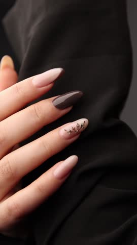 At the beauty salon. The manicurist shows off a well-done manicure.