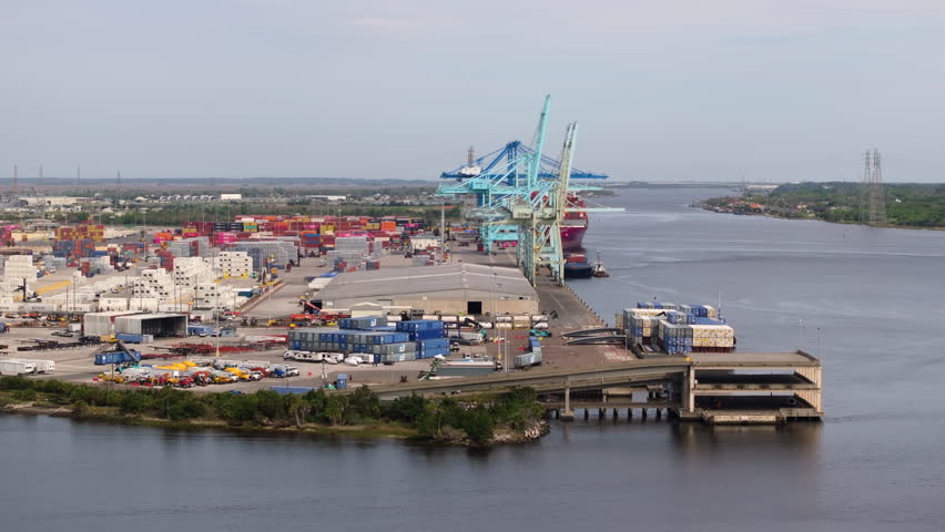 Loading container ship in port of Savannah, Georgia. Freight containers for international shipment of produced goods.