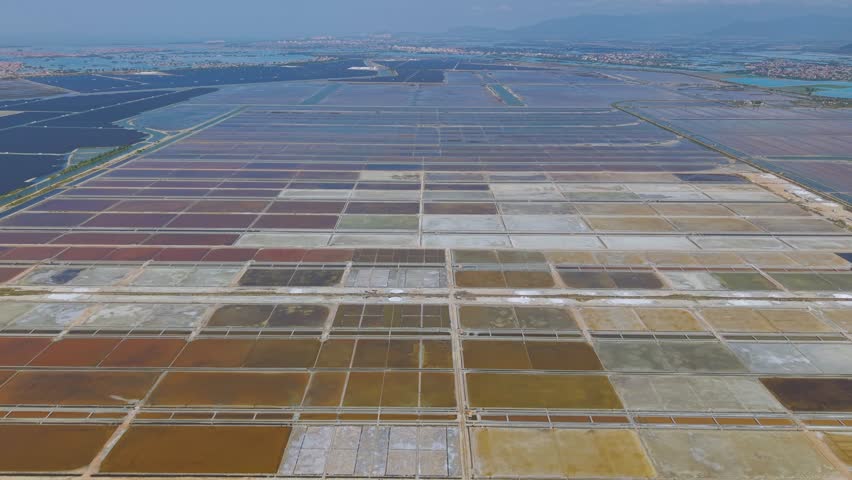 Aerial footage of The Yinggehai Salt Works in Ledong County, the largest sea salt field in the Hainan province and the third largest in China. 