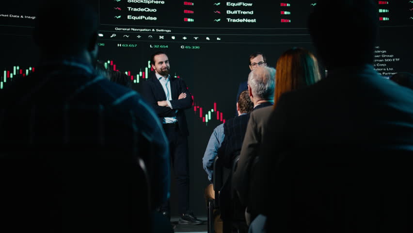 Professional male speakers hosting day trading presentation at business conference, explaining trading, investing and financial market trends. Stockbrokers monitor profit indicators. Camera A.