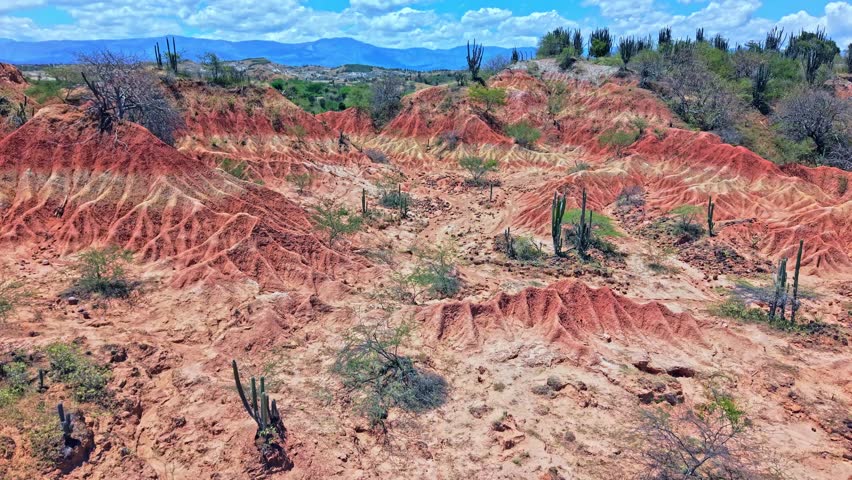 Unbelievable red desert reveal in captivating drone video in Tatacoa Region, Colombia. The deserts unique colour give added beauty to an already breathtaking natural landscape