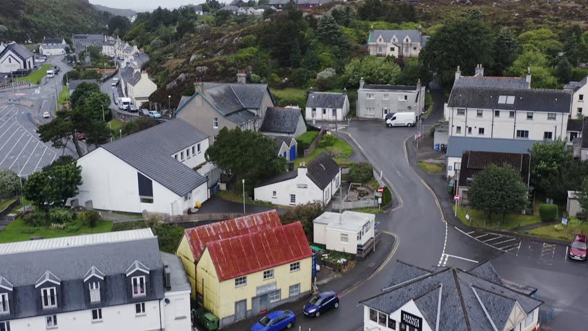 Drone shot of the ocean behind Tarbert town centre on the Isle of Harris.
