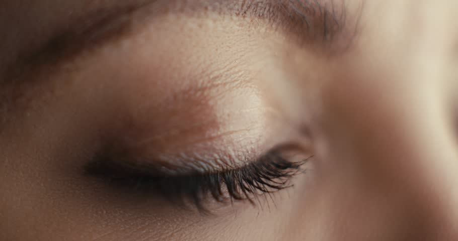 Close-up of striking blue eyes, highlighting beauty, emotion, human expression, and portrait photography aesthetics.