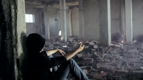Drug Addict getting High in an Abandoned Building Dramatic Crane Shot HD