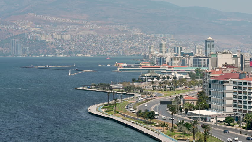 Izmir, turkey, august 8, 2025. Panoramic aerial view of the coastal city , showing the beautiful seascape, bustling road traffic, and urban skyline. Travel destination.