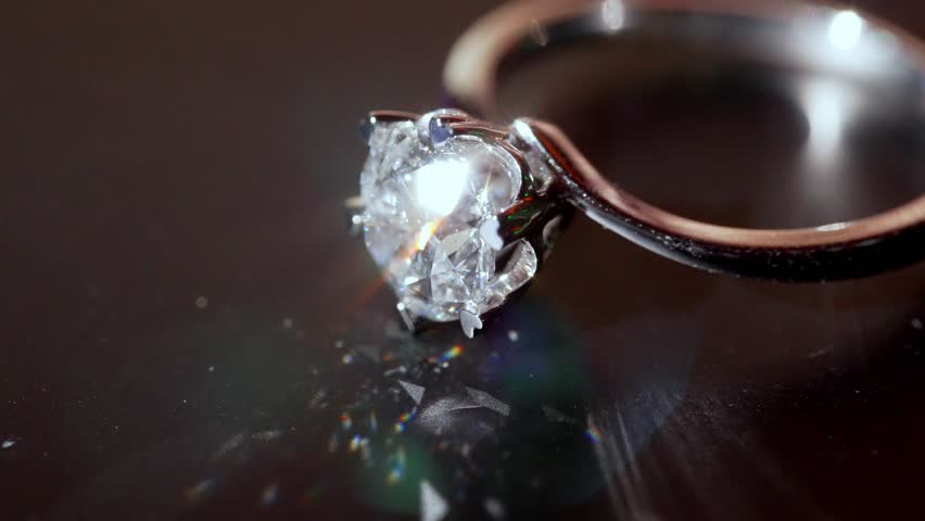 Dazzling Diamond Ring Appears in Soft Artistic Macro Shot. Featuring Clear Facets and Smooth Metal Curves. Refined Show of Luxury, Beauty and Craftsmanship With Mesmerizing Precision Close-up 4k
