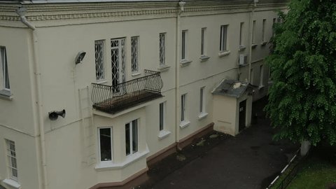 Drone Smoothly Taking Off beside Residential Building