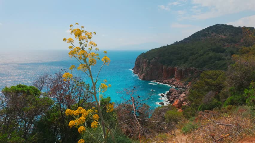 A scenic view of a beach  on Mediterranean coast of Turkey. Mediterranean beach during summer vacation. Nature view for summer vacation. 