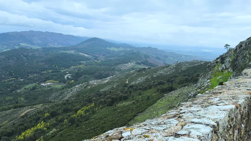 Panoramic View of Rolling Green Mountains in Serra de São Mamede, Portugal ,Scenic Landscape of Portuguese Highlands with Lush Valleys and Distant Horizons ,Mountain Range Vista: The Natural Beauty of Alentejo Region under Overcast Sky