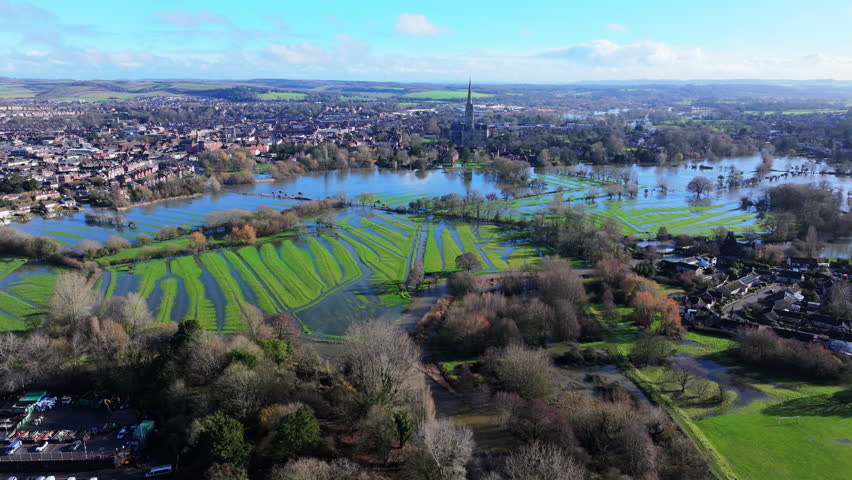 Aerial shot of flooded meadows and Cathedral in Salisbury, UK, after Storm Chandra.
