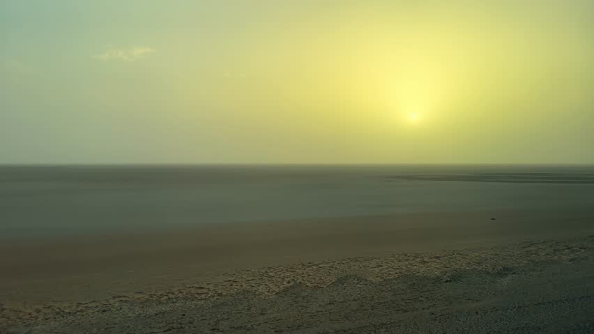 Drive along panoramic view of a serene sunrise over the vast expanse of the Sahara Desert