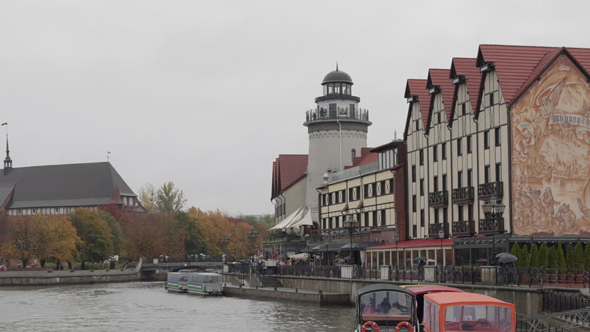The embankment in the center of Kaliningrad with a view of the Cathedral on a cloudy day.
