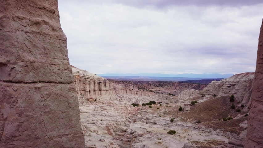Arid canyon and landscape, drone aerial, 4K, Abiqui New Mexico, White Chapel Rocks National Park, White Rock Formation, American Southwest, USA