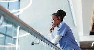 Black woman, nurse and headache in grief, stress or mistake on floor in hospital. Mental health, sad physician and medical person with low angle anxiety for burnout, loss or failed surgery at clinic - Powered by Shutterstock - Get 15% off with code: PIKWIZARD15