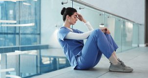Woman, nurse and headache in grief, anxiety or mistake on floor in hospital. Mental health, sad physician and healthcare person with emergency for burnout, loss or failed surgery stress at clinic - Powered by Shutterstock - Get 15% off with code: PIKWIZARD15