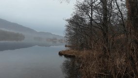 Mist over a lake in Lake District - Powered by Shutterstock - Get 15% off with code: PIKWIZARD15