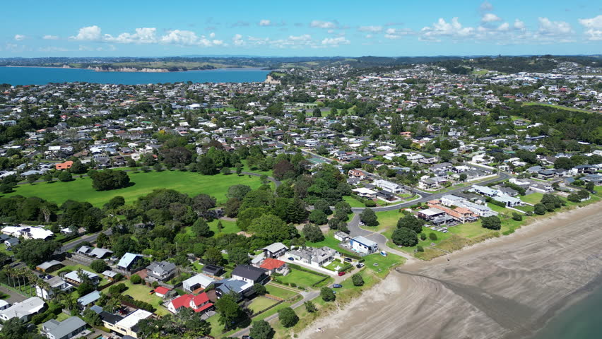Drone View Over Whangaparaoa Suburb and Coastline, New Zealand