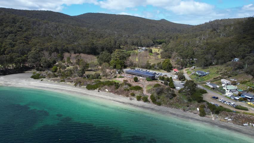 Pristine Sand and Fluted Cape Cliffs of Adventure Bay Beach Walk, Bruny Island, Tasmania, Australia - drone shot
