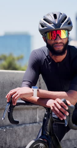 Black man, bicycle and smart watch in city for training with timer, thinking or heart rate for cardio exercise. African person, iot clock and sunglasses for cycling, bike or fitness app in urban town