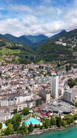 Montreux Switzerland aerial drone town on the shores of Lake Geneva with the Alps in background
