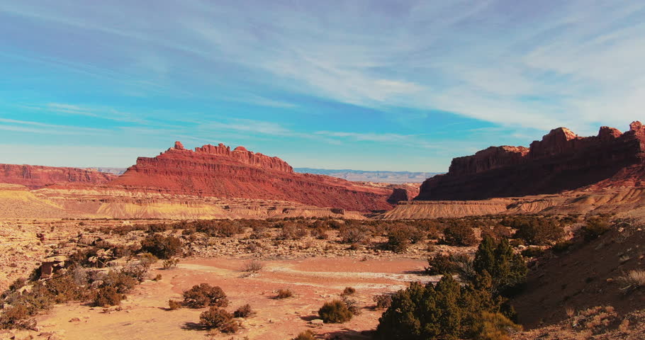 Wide Establishing Shot of Black Dragon Canyon Viewpoint Utah with Beautiful Blue Sky and White Clouds