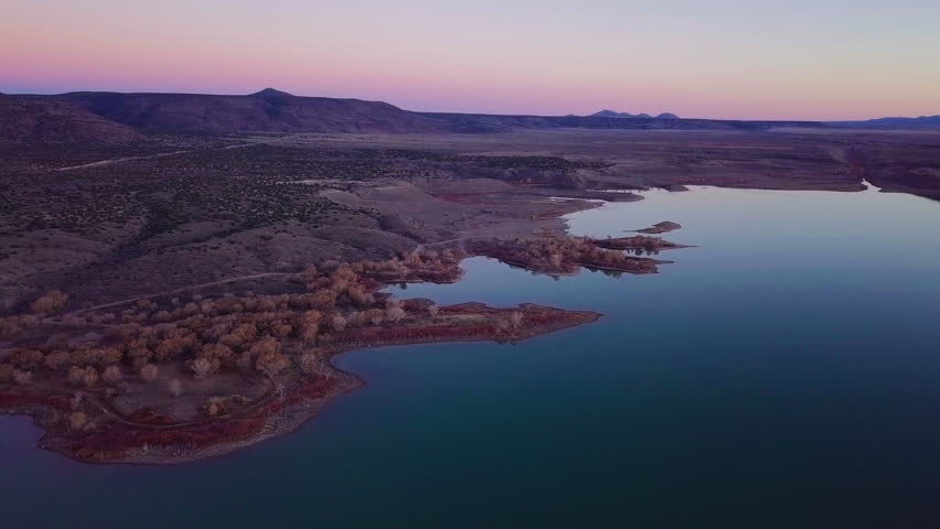 Lake with colorful reflections at sunset, Indian Reservation, Cochiti Lake, New Mexico Southwest, Drone Aerial, Golden Hour Landscape, 4K