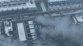 Hyperscale data center from above with its cooling system releasing steam into the cold winter air, showcasing modern cloud computing infrastructure - Powered by Shutterstock - Get 15% off with code: PIKWIZARD15