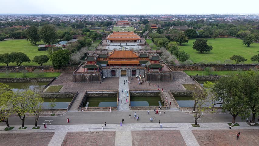 Aerial view of the Imperial City in Hue, Vietnam, showcasing historic architecture, city gates, moats, and surrounding greenery, reflecting cultural heritage and everyday life in central Vietnam.