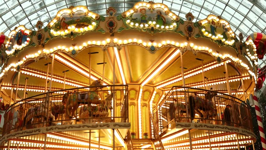 A colorful merry go round with bright lights and festive decorations, perfect for holiday or celebration scenes.