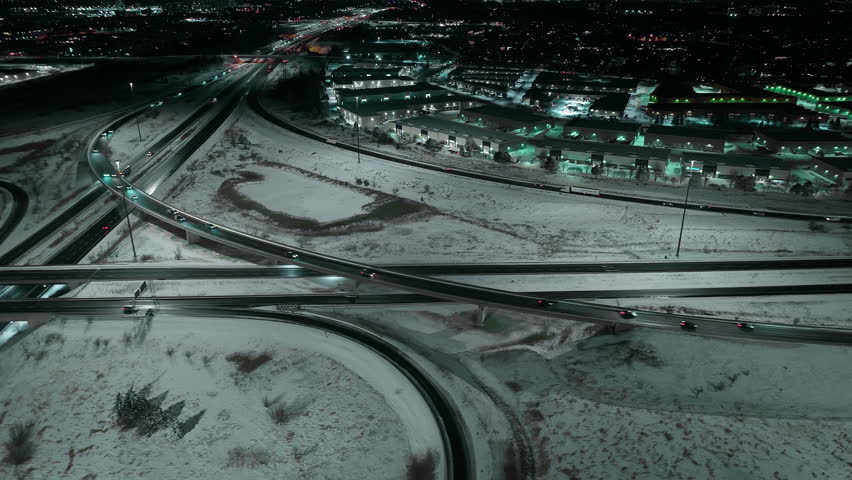 Aerial night view of snowy Mississauga highway junction in Ontario