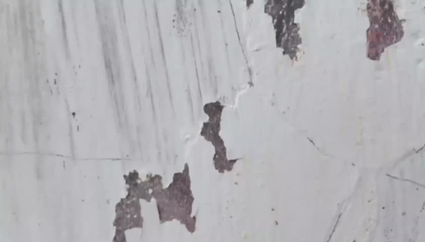 Looping vintage brown paint transition animation on old wall background with clean space for text and images.