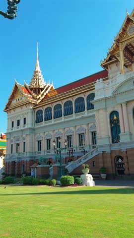 A majestic view of the Ananta Samakhom Throne Hall in Bangkok, Thailand, showcasing its grandeur and intricate design under a clear blue sky