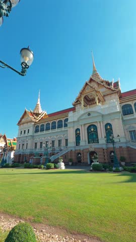 A majestic view of the Ananta Samakhom Throne Hall in Bangkok, Thailand, showcasing its grand architecture and lush green surroundings
