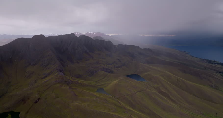 Laguna Langui highland ridges in Langui District, near Cusco, Peru, during cloudy weather. Remote Andes landscape, South America, aerial view