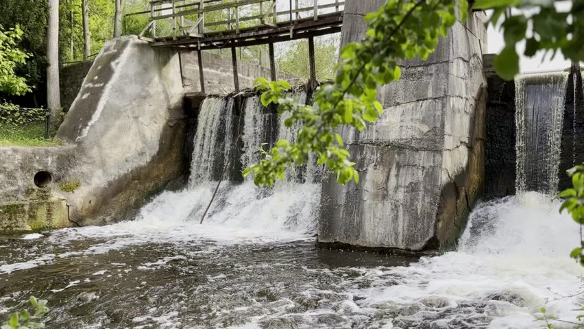Water Flowing Over A Waterfall At A Historic Mill On The Credit River In Caledon, Ontario, Canada,