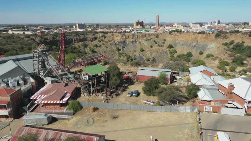 Kimberley, South Africa - October 1, 2023:  Slowly rotate around Big Hole Mine Museum complex, mining headgear and diamond mine pit behind