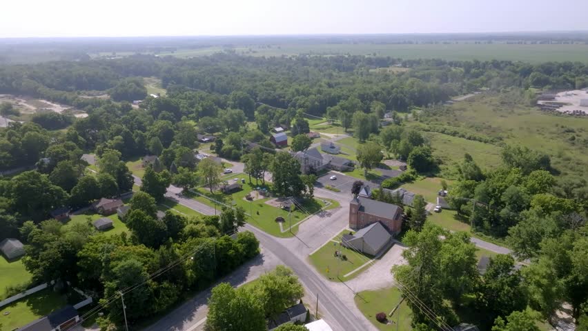 Neighborhood homes in Newaygo, Michigan with drone video moving in.
